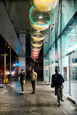 Boarders and Bike under the lights